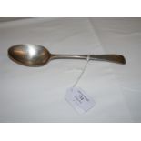 A silver serving spoon