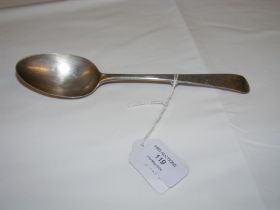 A silver serving spoon