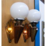 A pair of stylish Art Deco copper wall lights with