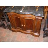 An antique serpentine fronted cabinet with marble