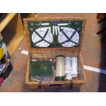 A vintage Optima cane picnic basket with picnic wa