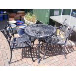 A black and metal bistro garden table with two cha