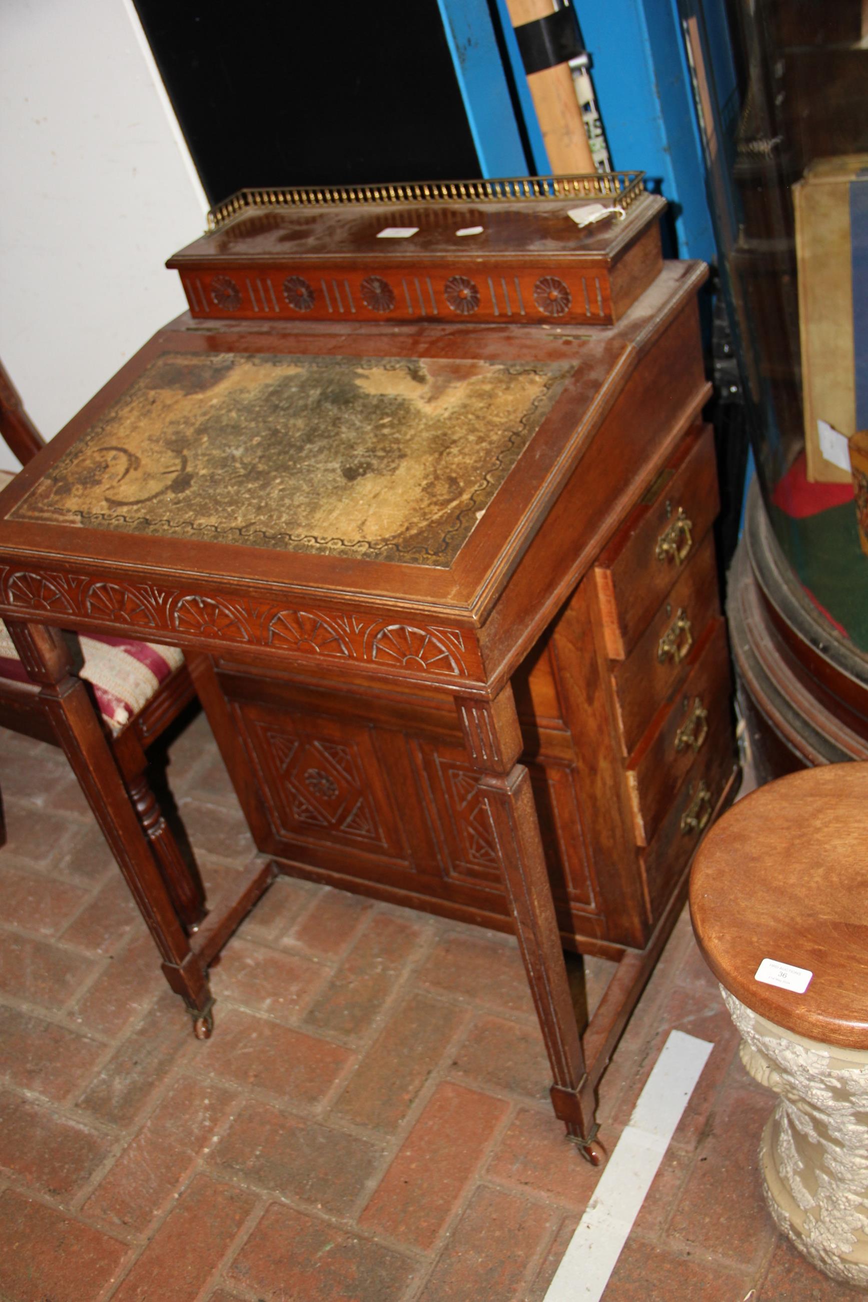 An Edwardian Davenport desk with four drawers to t