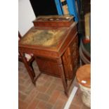 An Edwardian Davenport desk with four drawers to t