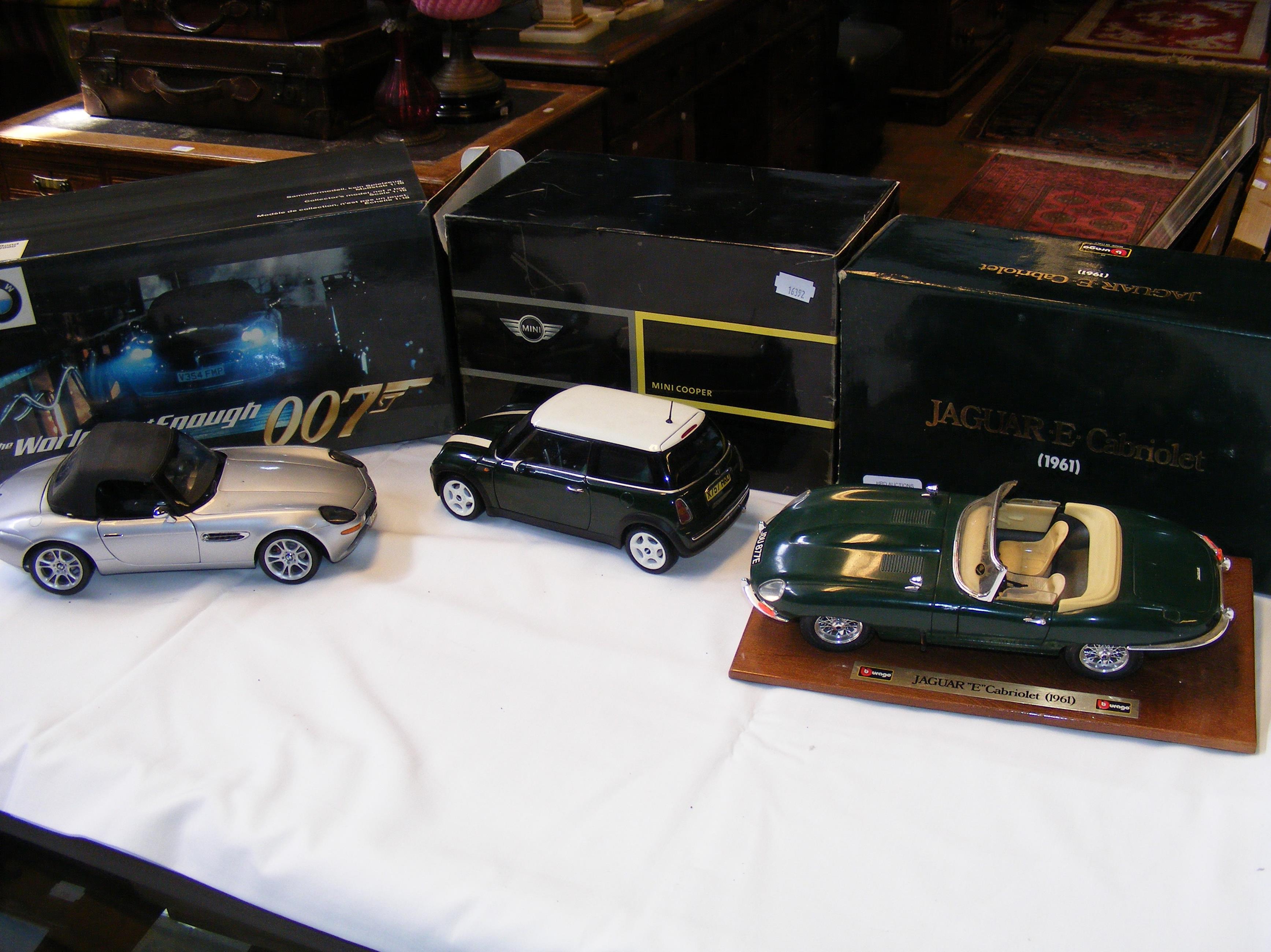 Three boxed die cast classic cars including 1961 J