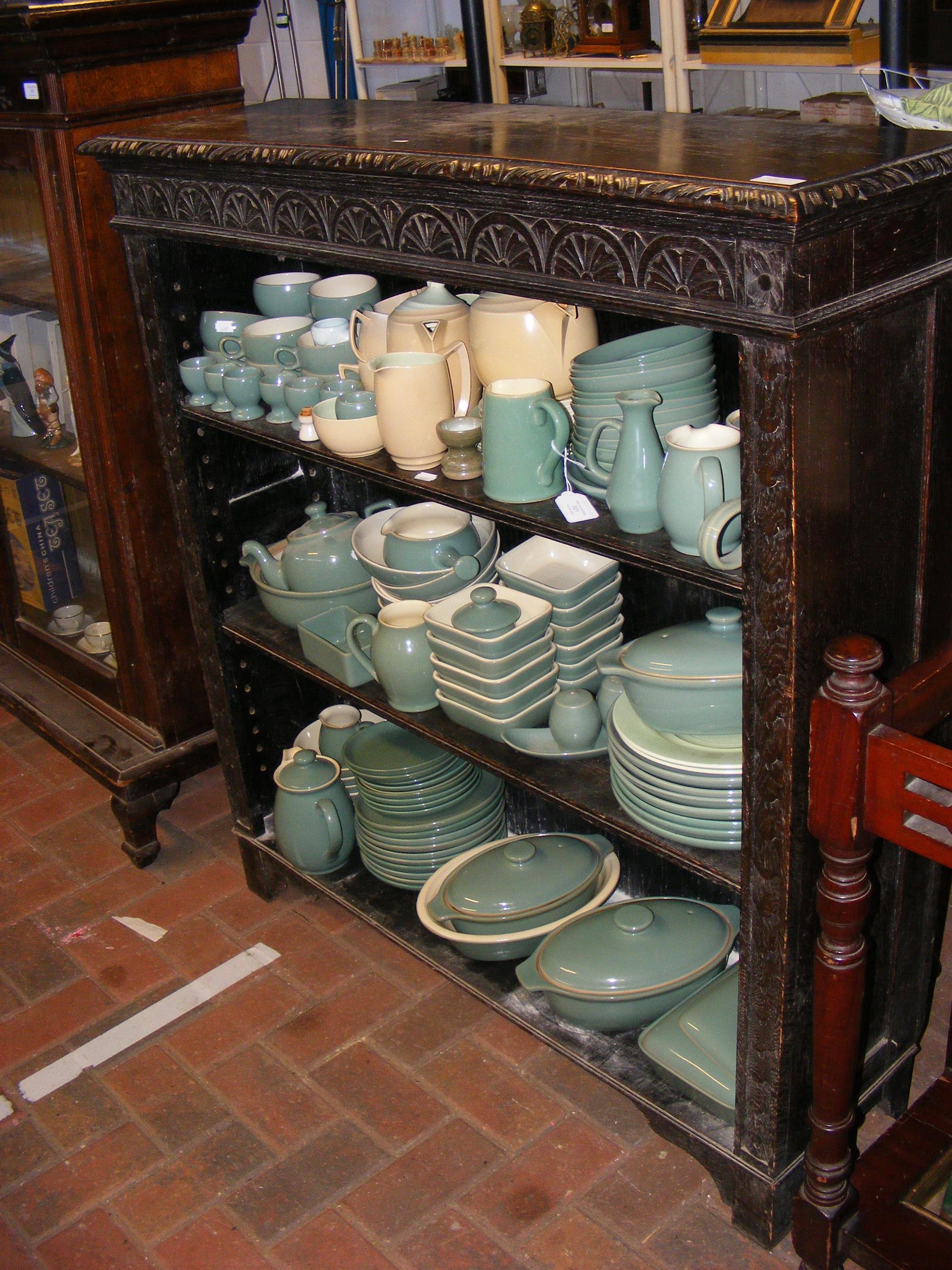 An oak open bookcase with carved frieze - width 10