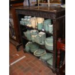 An oak open bookcase with carved frieze - width 10