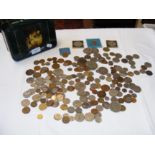 A tin box containing collectable coinage