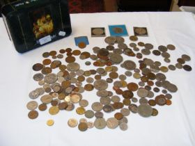 A tin box containing collectable coinage