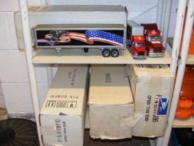 Two shelves of die cast model vehicles