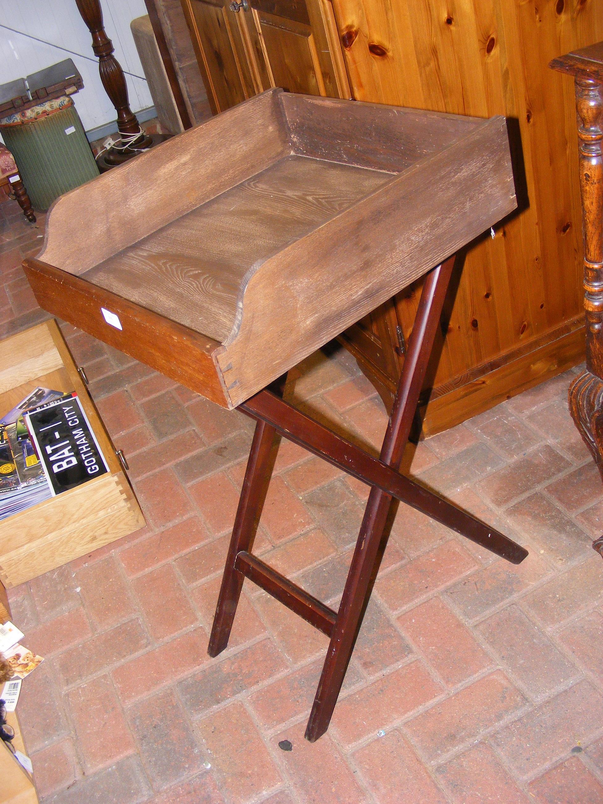 A Butler's tray on folding stand