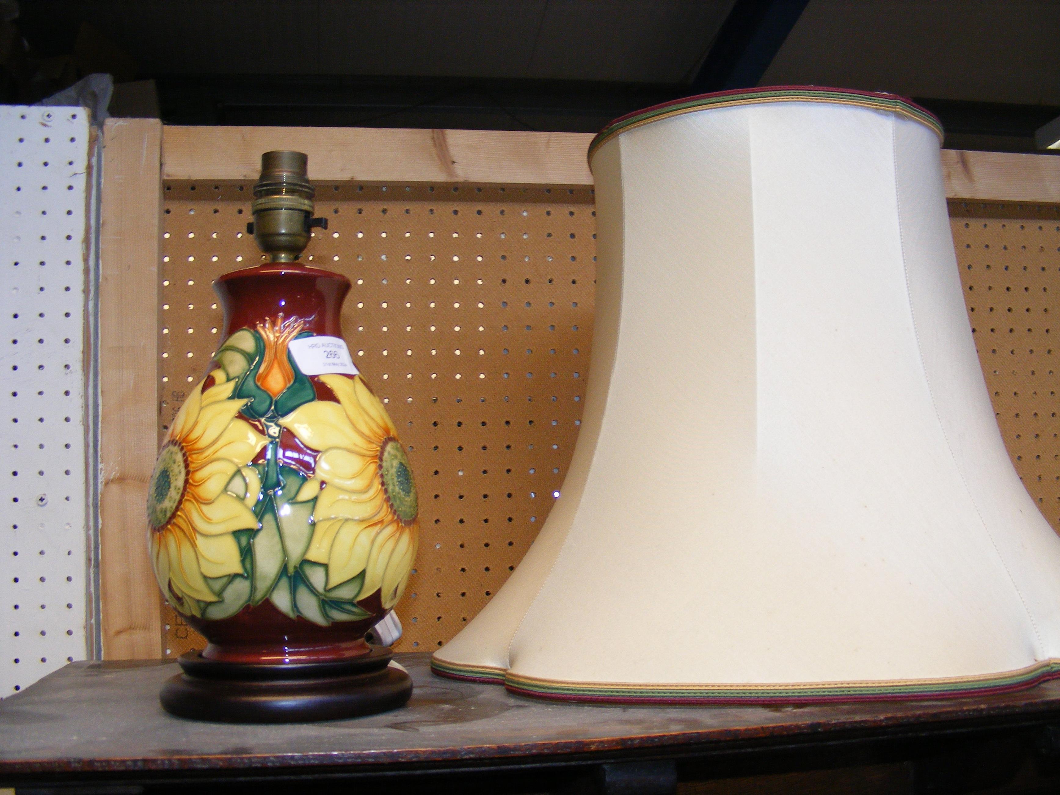 A Moorcroft Pottery table lamp with tube line deco