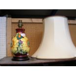 A Moorcroft Pottery table lamp with tube line deco