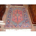 A Middle Eastern rug with geometric border - 150cm