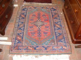 A Middle Eastern rug with geometric border - 150cm