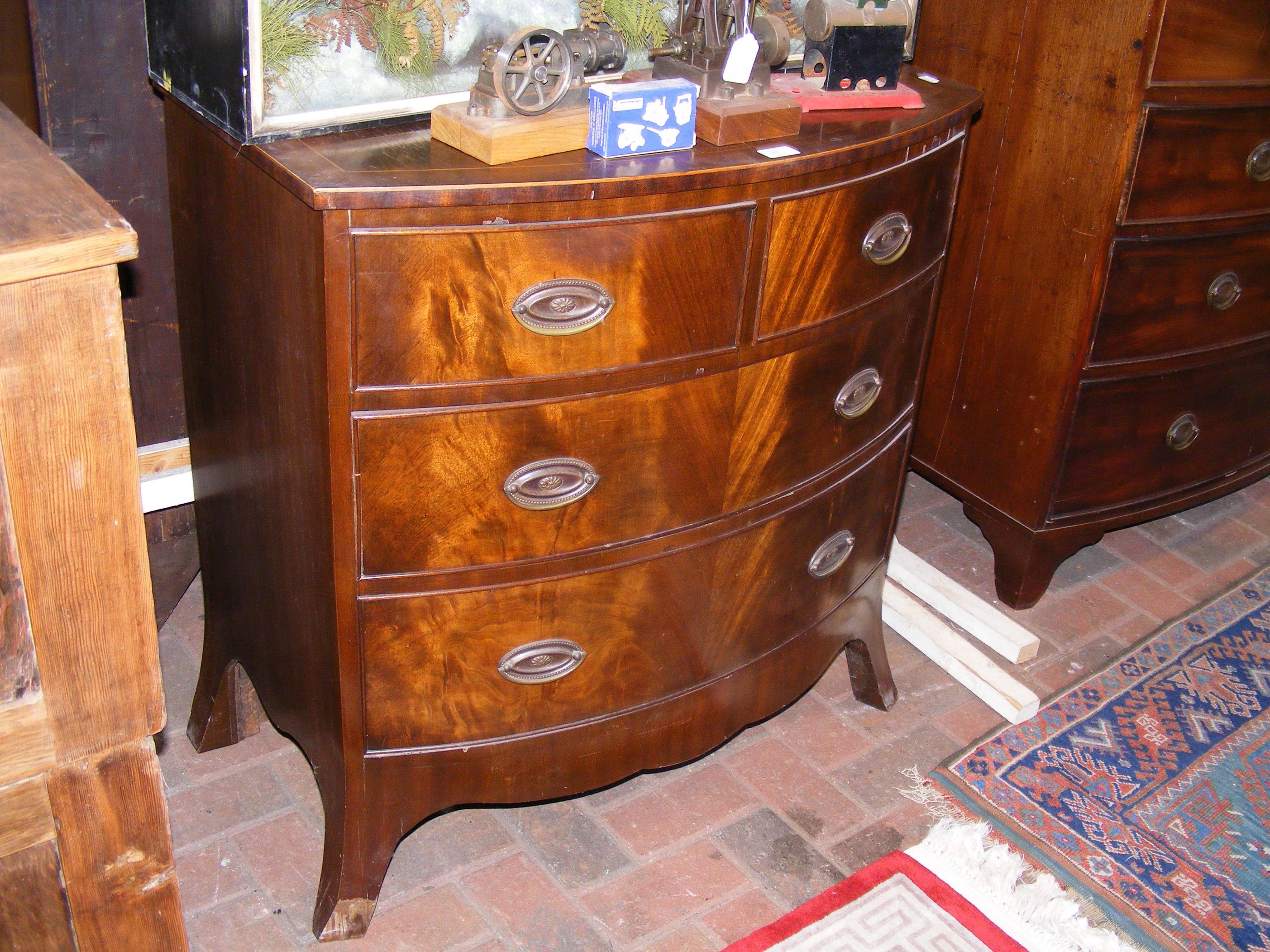 An 80cm wide bow fronted chest of drawers