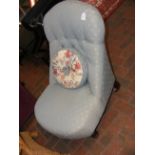A Victorian nursing chair with button back