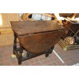 An antique gate-leg table