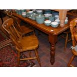 A lacquered pine farmhouse kitchen table together