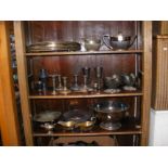 Three shelves of silver plate