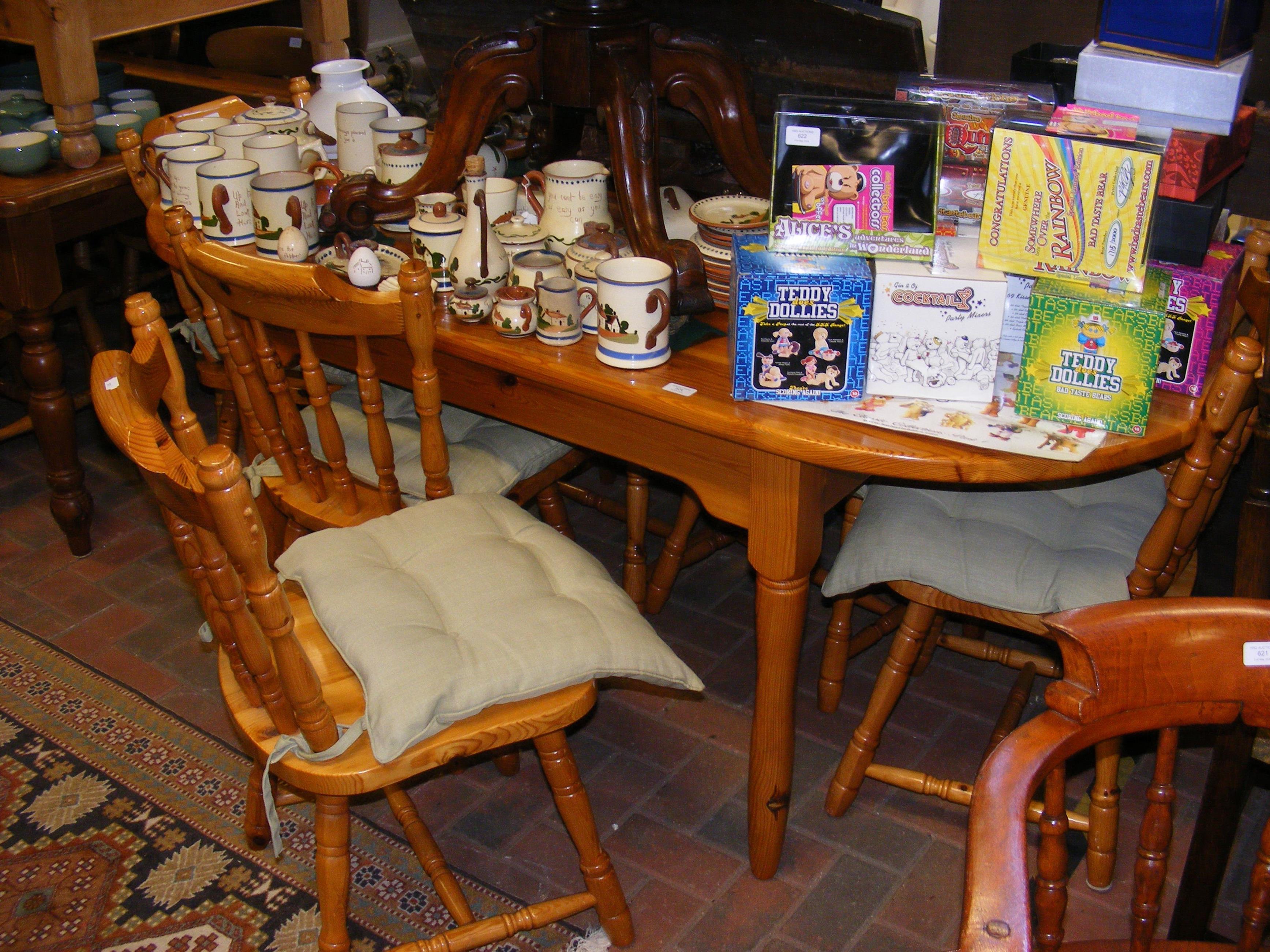 A lacquered pine farmhouse kitchen table with six