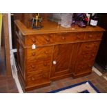 A Victorian pedestal desk with nine drawers to the