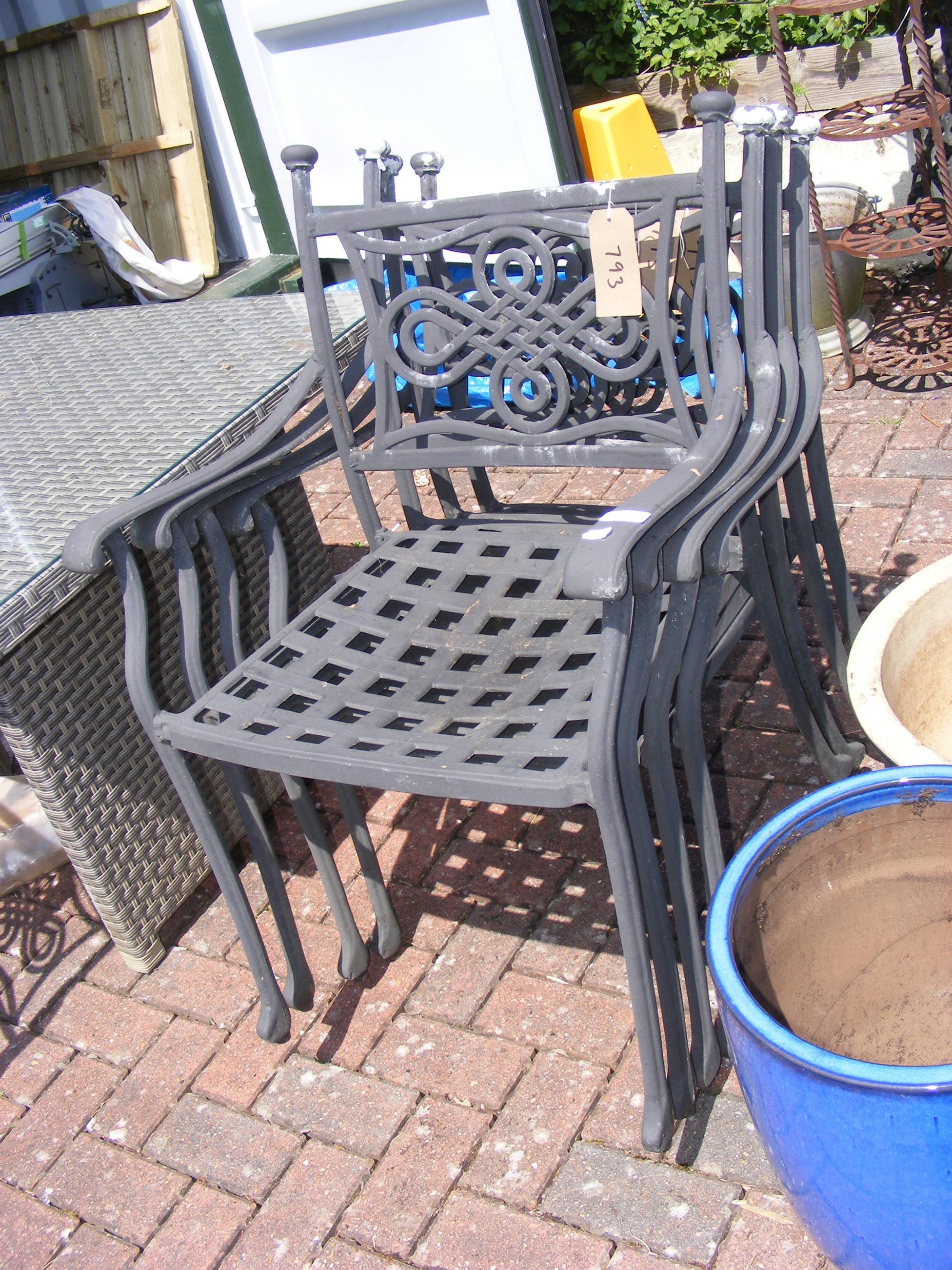 Four black and metal garden chairs