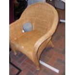 A canework armchair