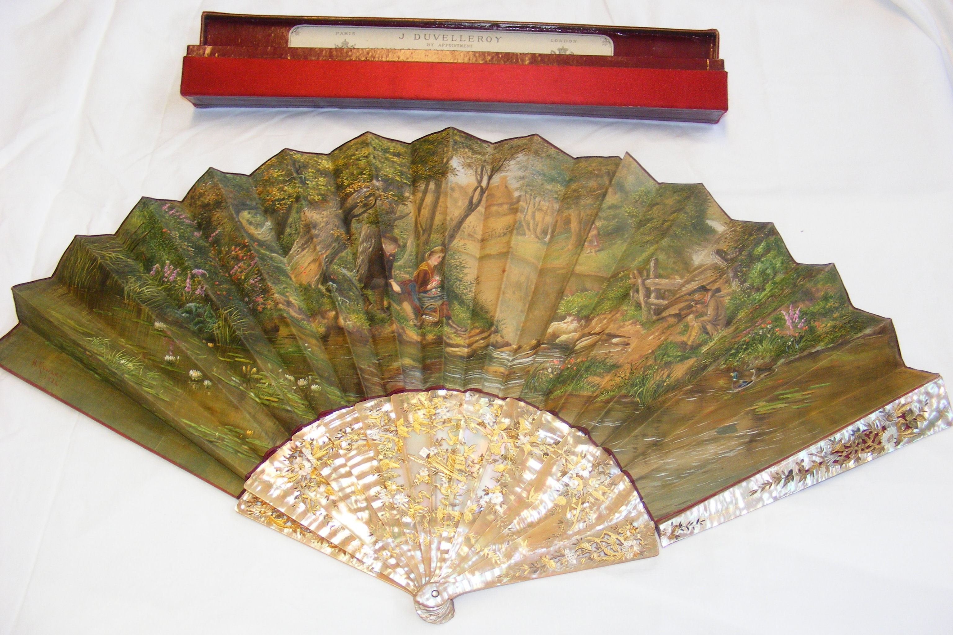An antique hand painted fan by H.Rowley, 1884 with mother of pearl stick