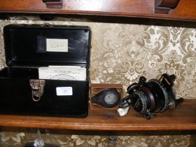 A WWII military compass together with a Bakelite h