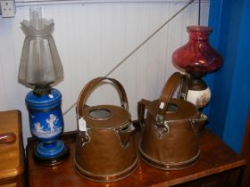 A pair of 35cm high antique copper kettles, togeth