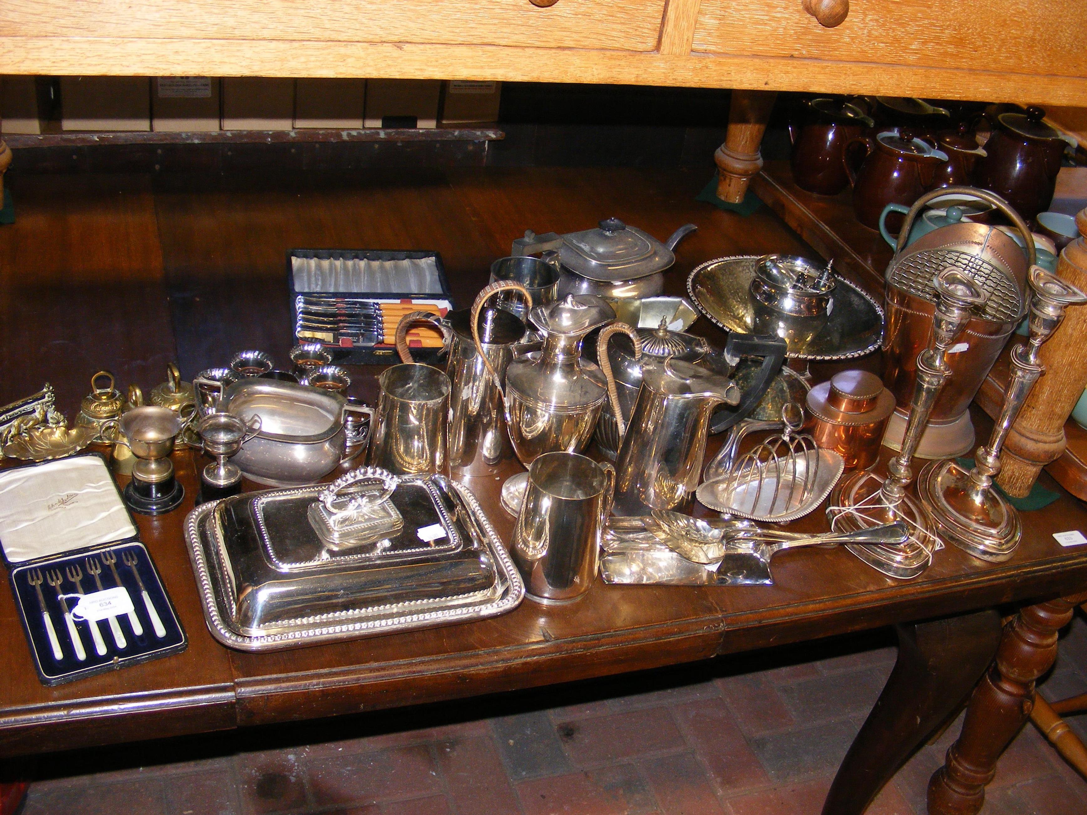 A cased set of silver canape forks together with a