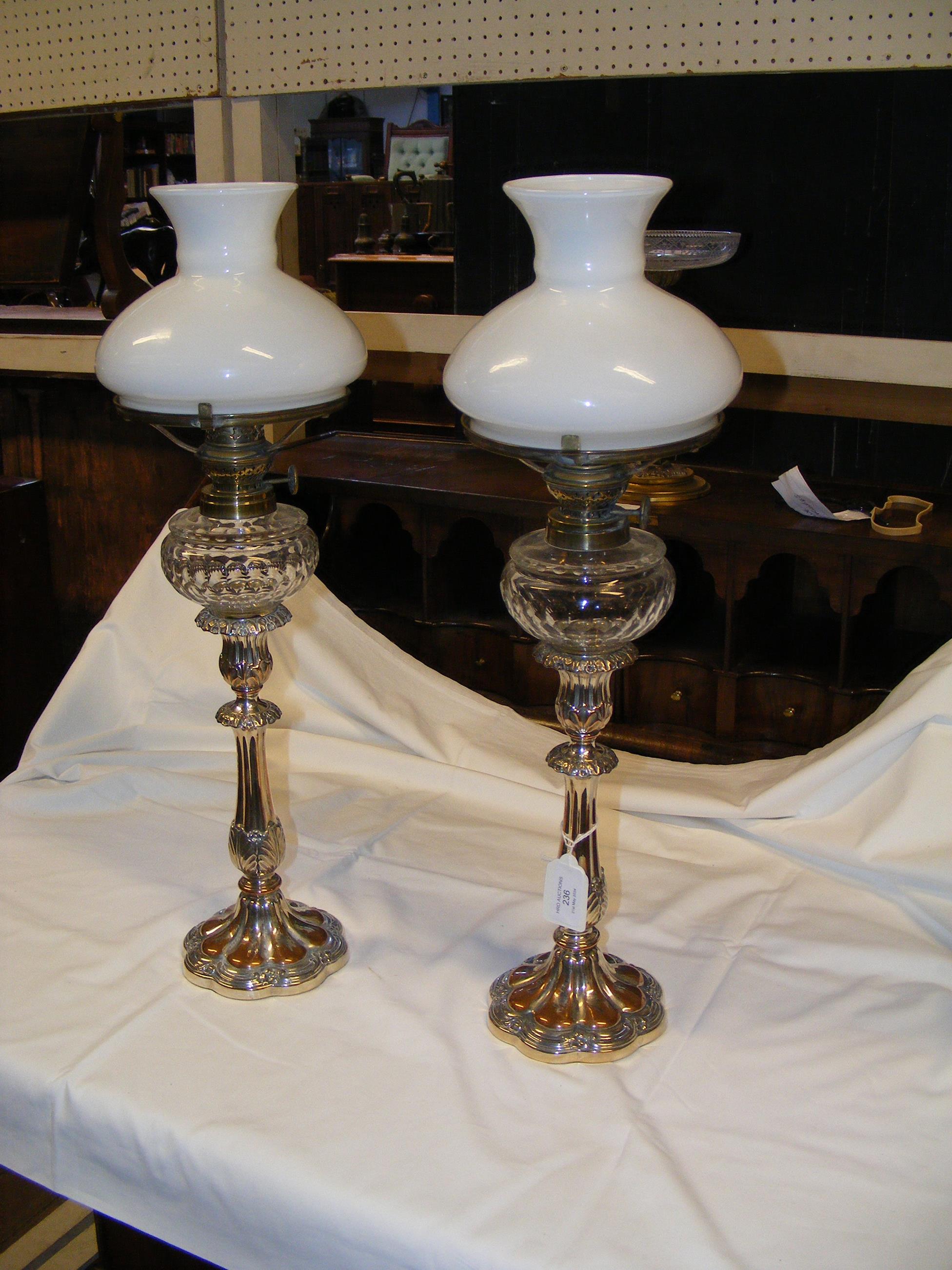 A pair of decorative 45cm high silver plated oil l