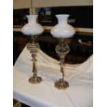 A pair of decorative 45cm high silver plated oil l