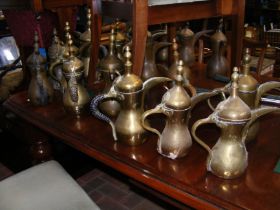 A selection of brass Turkish coffee pots