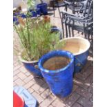 Four blue glazed garden pots of varying size