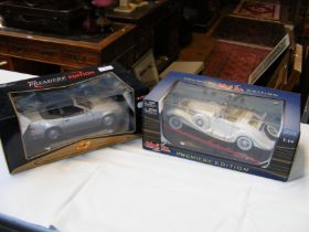 A boxed die cast Mercedes Benz together with one o