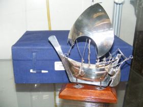 A silver Arabian Dhow on stand, in fitted case