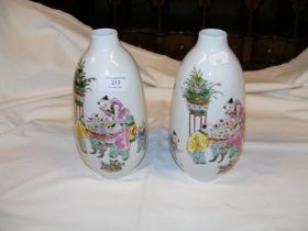 A pair of Chinese vases - 20cm high with character