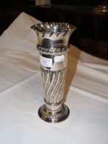 A silver trumpet vase - 23cms high