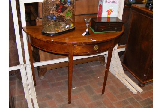 A 19th century half round hall table with single d