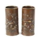 A FINE PAIR OF JAPANESE MEIJI PERIOD BRONZE AND MIXED METAL CYLINDRICAL VASES