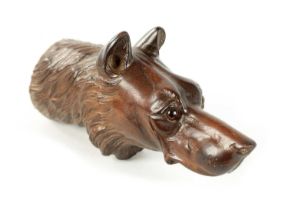 A LATE 19TH CENTURY BLACK FOREST CARVED DOG'S HEAD