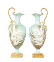 CHARLES H C. BALDWYN A FINE PAIR OF ROYAL WORCESTER RICHLY GILT AND SKY BLUE GROUND OVOID EWERS WITH