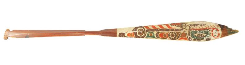 A 19TH CENTURY AMERICAN TRIBAL STAINED SOFTWOOD DANCE PADDLE