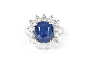 A LADIES LARGE 18CT WHITE GOLD SAPPHIRE AND DIAMOND RING