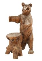 A GOOD 19TH CENTURY CARVED LINDEN WOOD BLACK FOREST BEAR STOOL