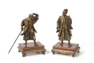 A FINE QUALITY PAIR OF JAPANESE MEIJI PERIOD PATINATED BRONZE AND GILT SCULPTURES BY MIYAO