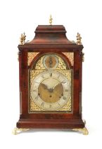 JOHN TAYLOR, LONDON. A GEORGE III FIGURED MAHOGANY QUARTER CHIMING BRACKET CLOCK