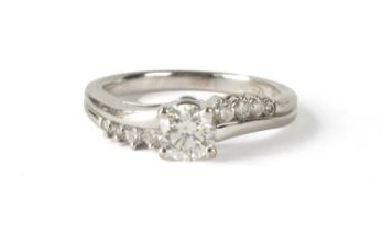 A 0.54CT DIAMOND AND 18CT WHITE GOLD SOLITAIRE RING